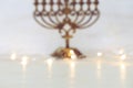 Religion image of bokeh blured background with jewish holiday Hanukkah menorah traditional candelabra. For product display Royalty Free Stock Photo