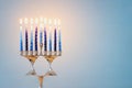Religion image of jewish holiday Hanukkah background with david star menorah & x28;traditional candelabra& x29; and candles
