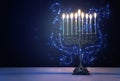 Religion image of jewish holiday Hanukkah background with menorah traditional candelabra and candles Royalty Free Stock Photo