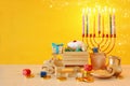 religion image of jewish holiday Hanukkah background with menorah & x28;traditional candelabra& x29;, spinning top and doughnut Royalty Free Stock Photo