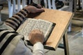 Religion reading prayer book. Torah on the table in front of the wailing wall in the old city of Jerusalem Israel Royalty Free Stock Photo