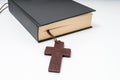 Religion or theology concept. Bible book and crucifix Royalty Free Stock Photo