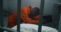 Religious African American prisoner prays to God