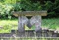 religious altar made of stone with an m to indicate our lady Sai