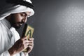 Religious arab muslim man holding holy quran