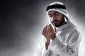 Religious arab muslim man praying