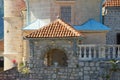 Religious architecture, details. Walls of ancient Church of Our Lady of the Rocks on sunny summer day. Montenegro Royalty Free Stock Photo