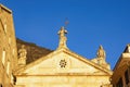 Religious architecture. Three statues on gamble of church. Montenegro, Perast town, Church of St. Mark