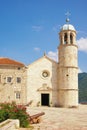 Religious architecture. View of ancient Church of Our Lady of the Rocks on sunny summer day. Montenegro, Bay of Kotor Royalty Free Stock Photo