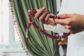 Religious Asian buddhist woman praying with hand holding rosary beads. Female buddhist disciple meditating, chanting