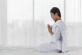 Religious Asian buddhist woman in white cloth praying and chanting Royalty Free Stock Photo