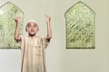 Religious asian muslim child standing praying to god Royalty Free Stock Photo