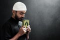 Religious asian muslim man hold holy quran