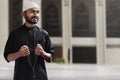 Religious asian muslim man holding rosary bead