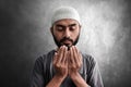 Religious asian muslim man praying