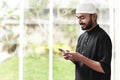 Religious asian muslim men use handphone