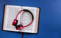 Religious audiobook with Bible and headphones