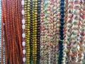 Religious beads with colorful strings. Muslim prayer chaplet market close up shot. Colorful plastic rosaries in the market.