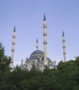 Religious building a mosque made of white mineral stone with four minarets, a place of worship