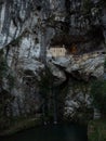 Religious catholic christian pilgrimage site Santa Cueva Holy Cave of Covadonga in rock wall waterfall Asturias Spain Royalty Free Stock Photo