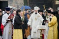 Religious Christian feast of the Epiphany. Priest, the bishop blesses the water and people Royalty Free Stock Photo