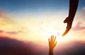 religious concept,God's helping hand and cross on sunset background Royalty Free Stock Photo