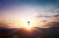 Silhouette of Jesus with Cross over calvary sunset background