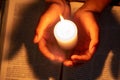 Religious concepts, The young man prayed on the Bible in the room and lit the candles to illuminate