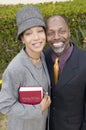 Religious Couple with Bible in garden Royalty Free Stock Photo