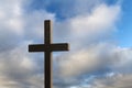 Religious cross against blue, cloudy sky Royalty Free Stock Photo