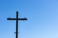 Religious cross with blue sky background, copy space Royalty Free Stock Photo