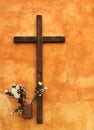 Religious cross on orange wall Royalty Free Stock Photo