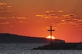 Religious cross and rising sun behind it. Resurrection of the lord, easter, nativity of Jesus Christ. Nessebar, Bulgaria Royalty Free Stock Photo