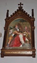 A religious depiction of Jesus falling carrying a cross on his back in the Capuchin Church of Our Lady of Lourdes in Rijeka. Royalty Free Stock Photo