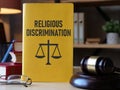 Religious Discrimination is shown using the text on the book and photo of court gavel Royalty Free Stock Photo