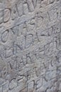 Religious engraved letters on stone wall Royalty Free Stock Photo