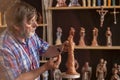 Religious figurine artisan in fair