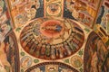 Religious fresco on church walls. The dome of a orthodox church with frescoes of Mother of God and Christ, the saints and angels