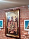 Religious image on a vintage red brick wall