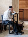 Religious Jewish man reads prayers in the Tomb of King David in the old city of Jerusalem, Israel Royalty Free Stock Photo