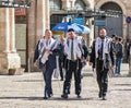 Religious Jews walk on a street near Jaffa Gate in the old city of Jerusalem, Israel