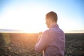 Religious man praying outdoors at sunset Royalty Free Stock Photo