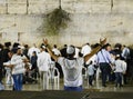 Religious men praying at the wailing wall in Jerusalem during Sukkot