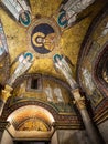 Religious mosaic showing Jesus surrounded by angels decorating ceiling of catholic church Royalty Free Stock Photo