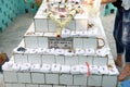 Religious objects are waiting for a blessing on the grave of Croatian missionaries, Jesuit father Ante Gabric in Kumrokhali, India Royalty Free Stock Photo