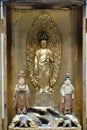 Religious oriental sculptural composition in a metal box