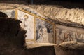 Religious paintings and frescoes of saints and the passion of Christ in the early Christian crypt in the basements of the church