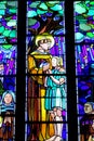 Religious picture on stained glass in the church