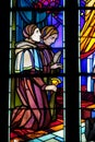 Religious picture on stained glass in the church Royalty Free Stock Photo