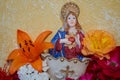 figurine of the mother of god with flowers,religious rituals of Catholics, worshiping God, praying and the Mother of God